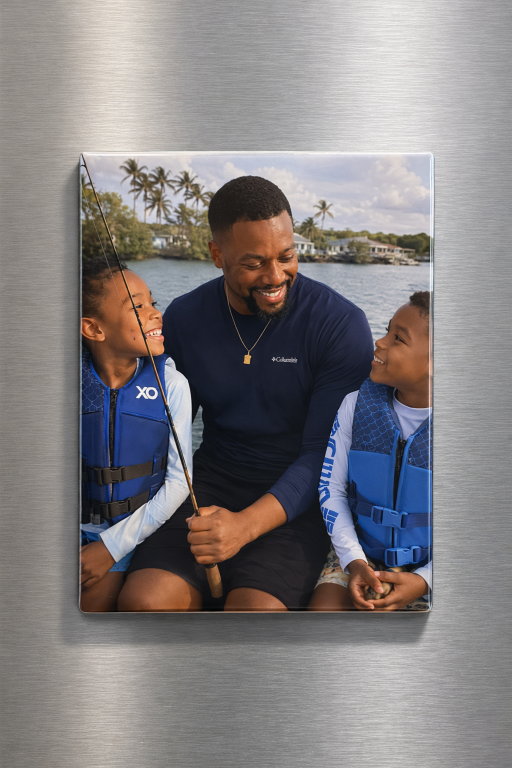 Photo magnet of man with two children wearing life vests on a fridge.