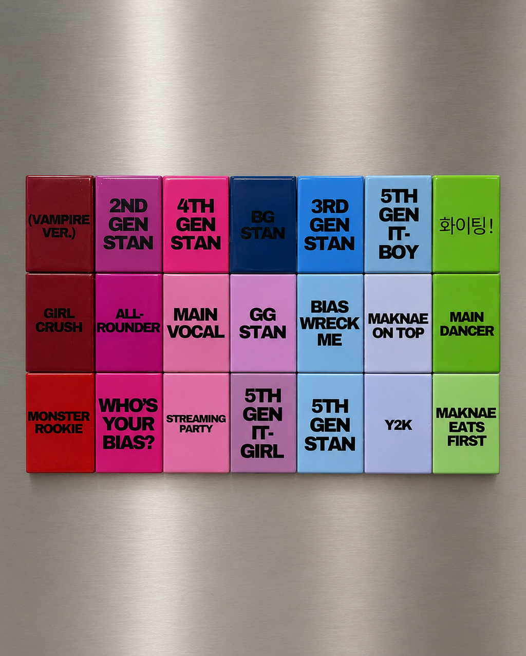 Colorful magnetic tiles with text on a metallic surface