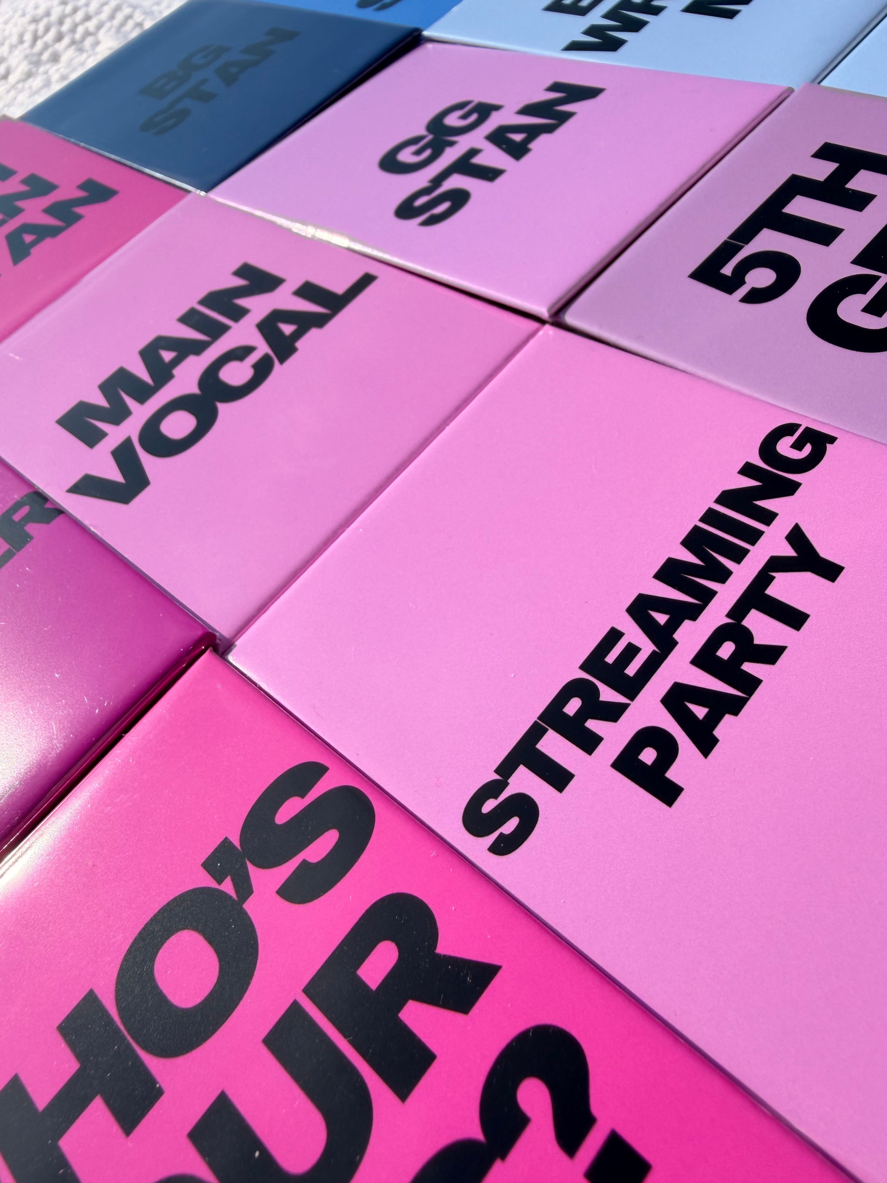 Pink and purple magnets with black text on a white background