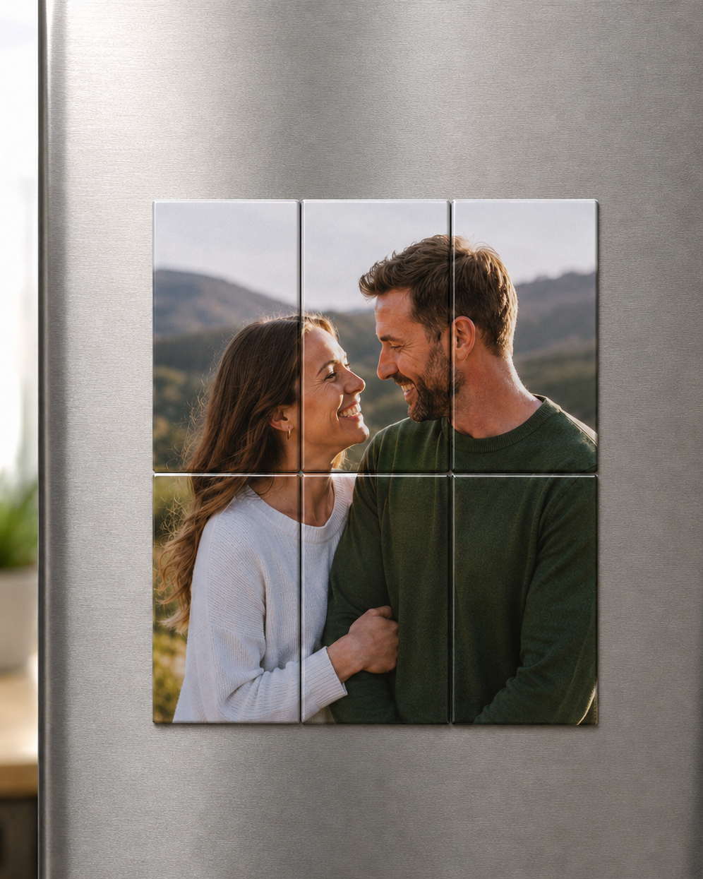 Fridge magnet with a couple's photo on a metallic surface